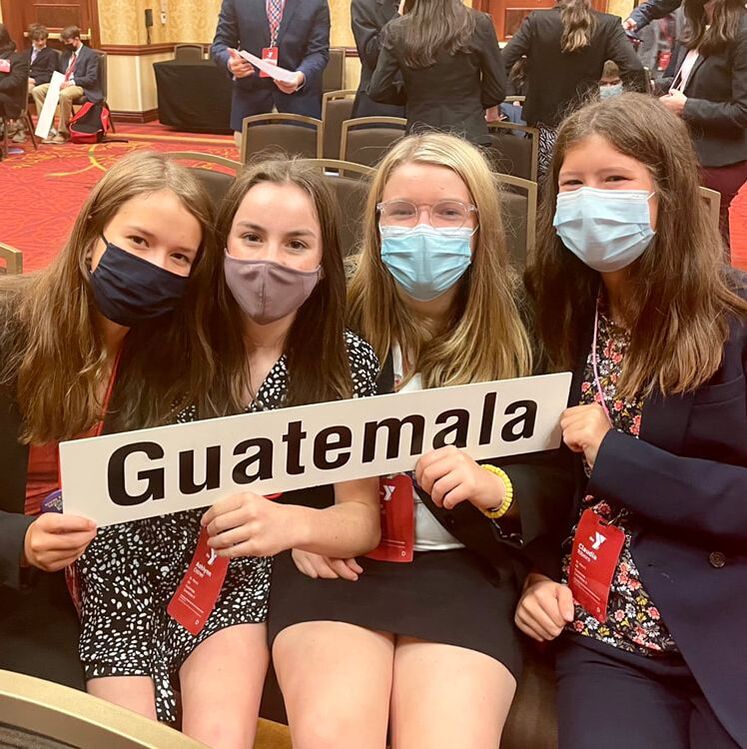 Freshmen Sarah Mae Fields, Ashlynn Ostner, Kate Wolfkill and Claudia Ribeiro represent Guatemala at their first high school Model UN Conference.