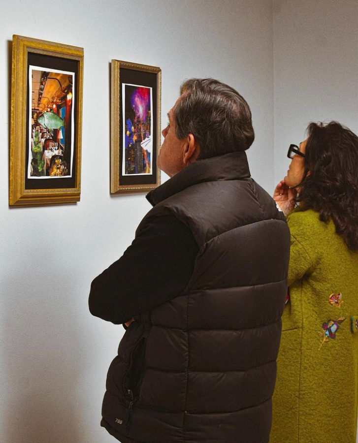 Upper school English teacher Mrs. Ray and her husband view Meghan Aslins collage exhibit.