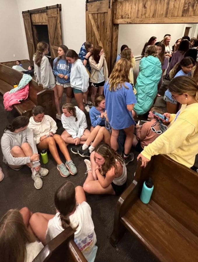 Freshmen mingle at Victory Ranch late at night. The retreat lasted from Aug. 17-19, giving the freshmen time to get to know each other before classes started. 