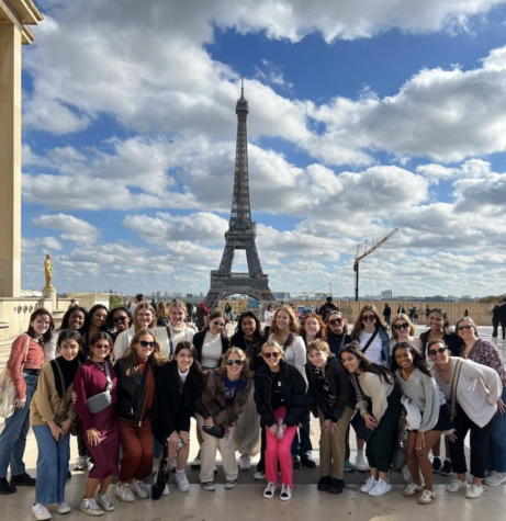 Students gather in front of the Eiffel Tower for the first abroad trip since before the pandemic. 