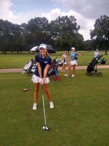 Sophia Wilson (9) stands ready to drive the ball down the course.