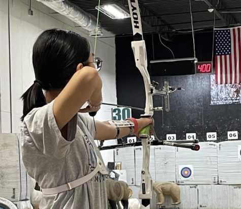 Casey Jang, an internationally recognized archer, is practicing for one of her many competitions. Jang has placed in many tournaments including second in the state. 