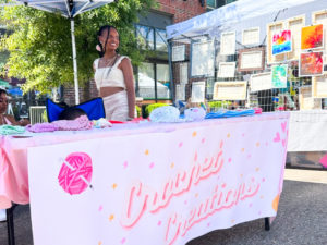 Senior Saniya Young sells her homemade crochet items at the annual Memphis Cooper Young festival. 