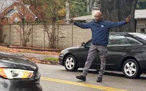 Mr. Mark Hooper, Director of Security, directs traffic after school helping everyone get home safely. Mr. Hooper was hired this year as the first Director of Security at St. Mary's.
