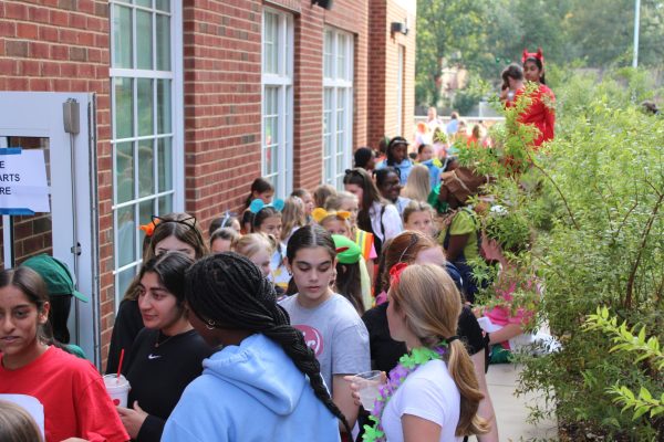 Students gather outside of the Upper School Dining hall, waiting to attend St. Mary's annual Halloween Bazaar. 