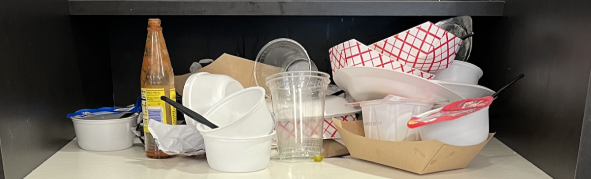 Dining Hall trash can overflow after Upper School lunch.