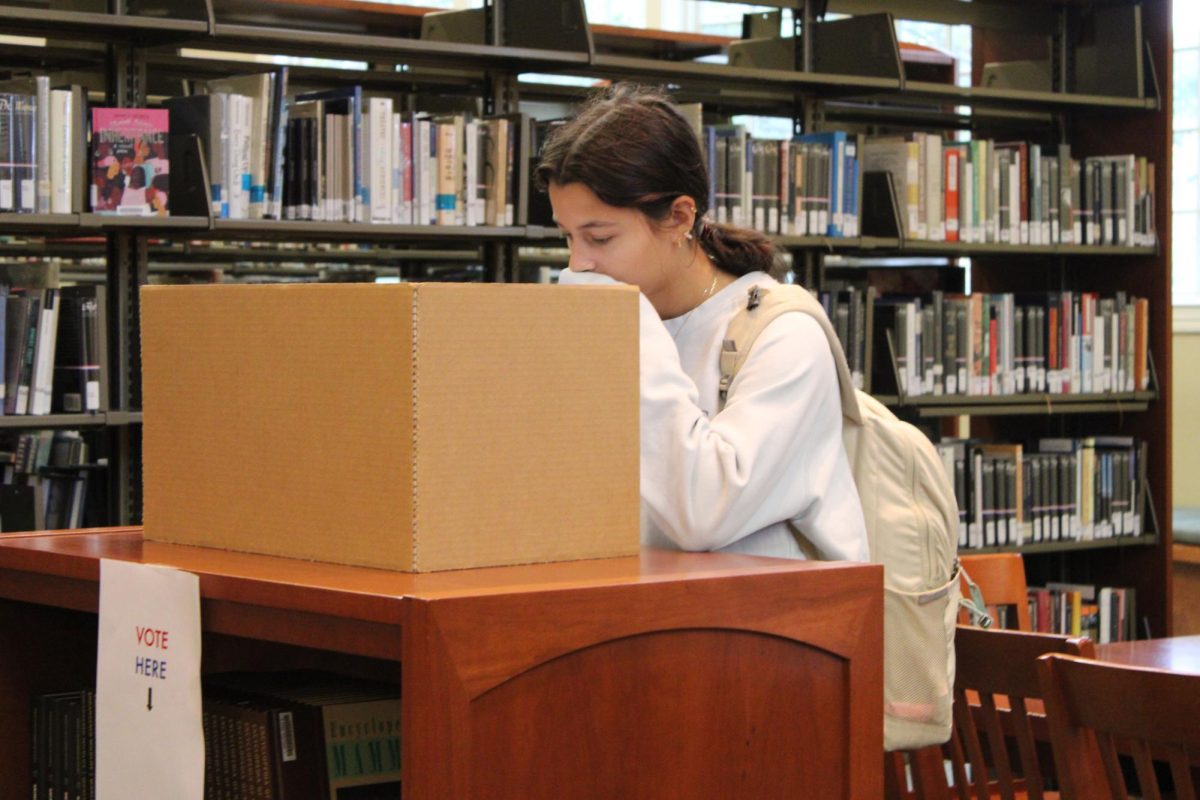 Junior Ellie Midha casts her ballot during the mock election at ALAPP. The St. Mary's mock election was held on Nov. 5 where students were invited to vote for the presidential race as well as the Tennessee senate race. 